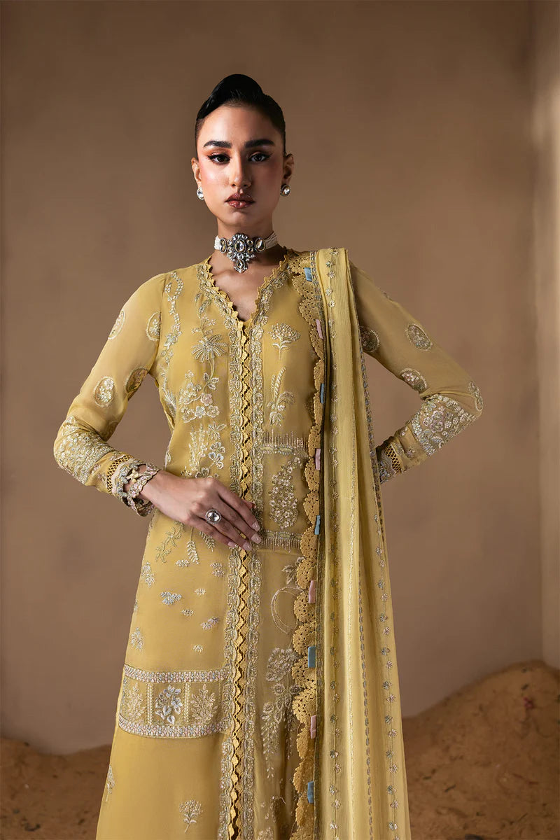 Woman wearing a yellow embroidered traditional outfit against a beige background.
Cymelle_By_Ruuposh_Collection_02