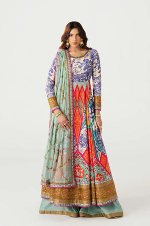 Woman wearing a colorful traditional outfit with a patterned dress and light blue dupatta on a white background.
Daruka_By_Ruuposh_Collection_05