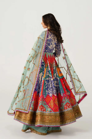 Woman wearing a colorful traditional outfit with a patterned design on a white background
Daruka_By_Ruuposh_Collection_06
