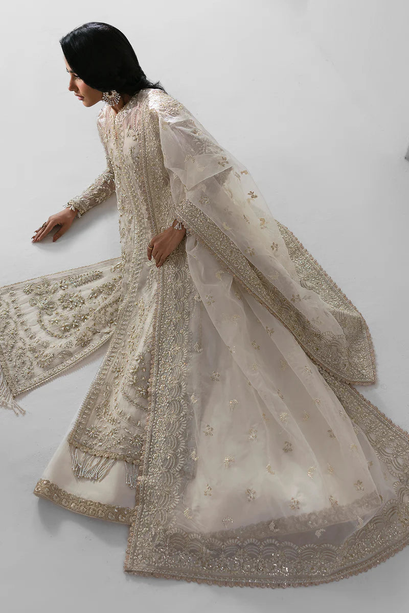 Woman wearing a traditional embroidered outfit with a white background.
Eclipse_By_Ruuposh_Collection_1