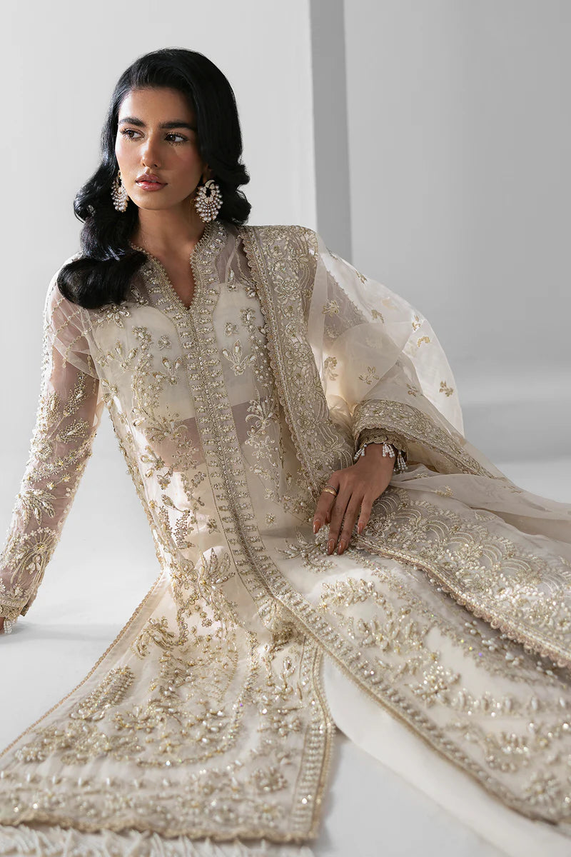 Woman wearing a traditional embroidered outfit with a white background.
Eclipse_By_Ruuposh_Collection_2