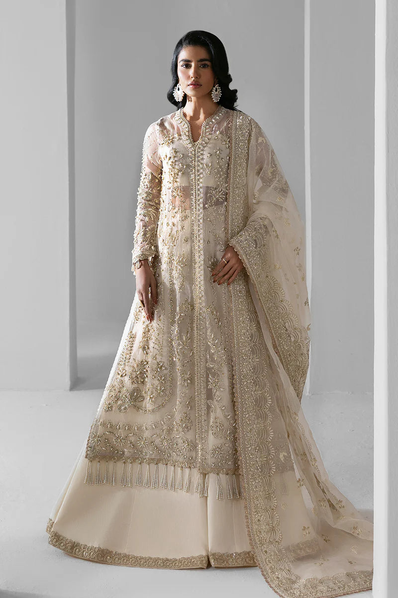 Woman wearing a traditional beige embroidered outfit with a white background.
Eclipse_By_Ruuposh_Collection_6
