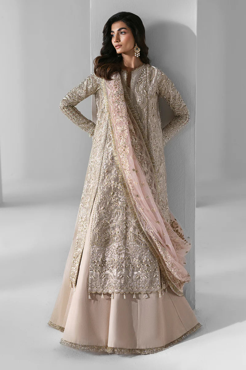 Woman wearing an embroidered beige traditional outfit with a pink dupatta against a white background.
Ember_By_Ruuposh_Collection_3