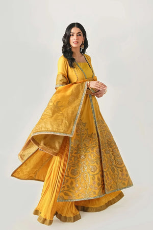 Woman wearing a yellow traditional outfit with intricate patterns on a white background.
Kunj Buta By Ruuposh Collection 05