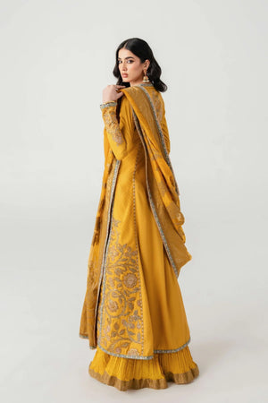 Woman wearing a mustard yellow traditional outfit with intricate designs on a white background.
Kunj Buta By Ruuposh Collection 06
