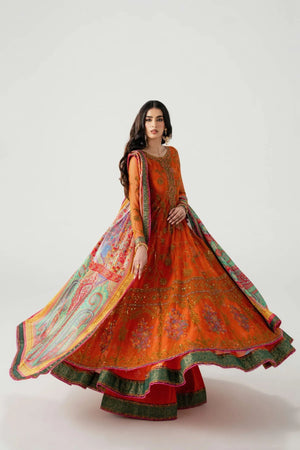 Woman wearing an orange and green traditional outfit with a floral pattern on a white background.
Mahlaqa Bai By Ruuposh Collection 02