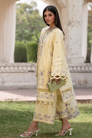 Woman in a light yellow floral dress standing outdoors with classical architecture in the background.
Moondale_By_Ruuposh_Collection_4