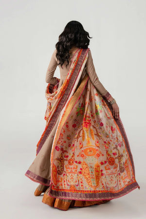 Woman wearing a traditional saree with intricate patterns on a plain background.
Naghz Beg By Ruuposh Collection 02
