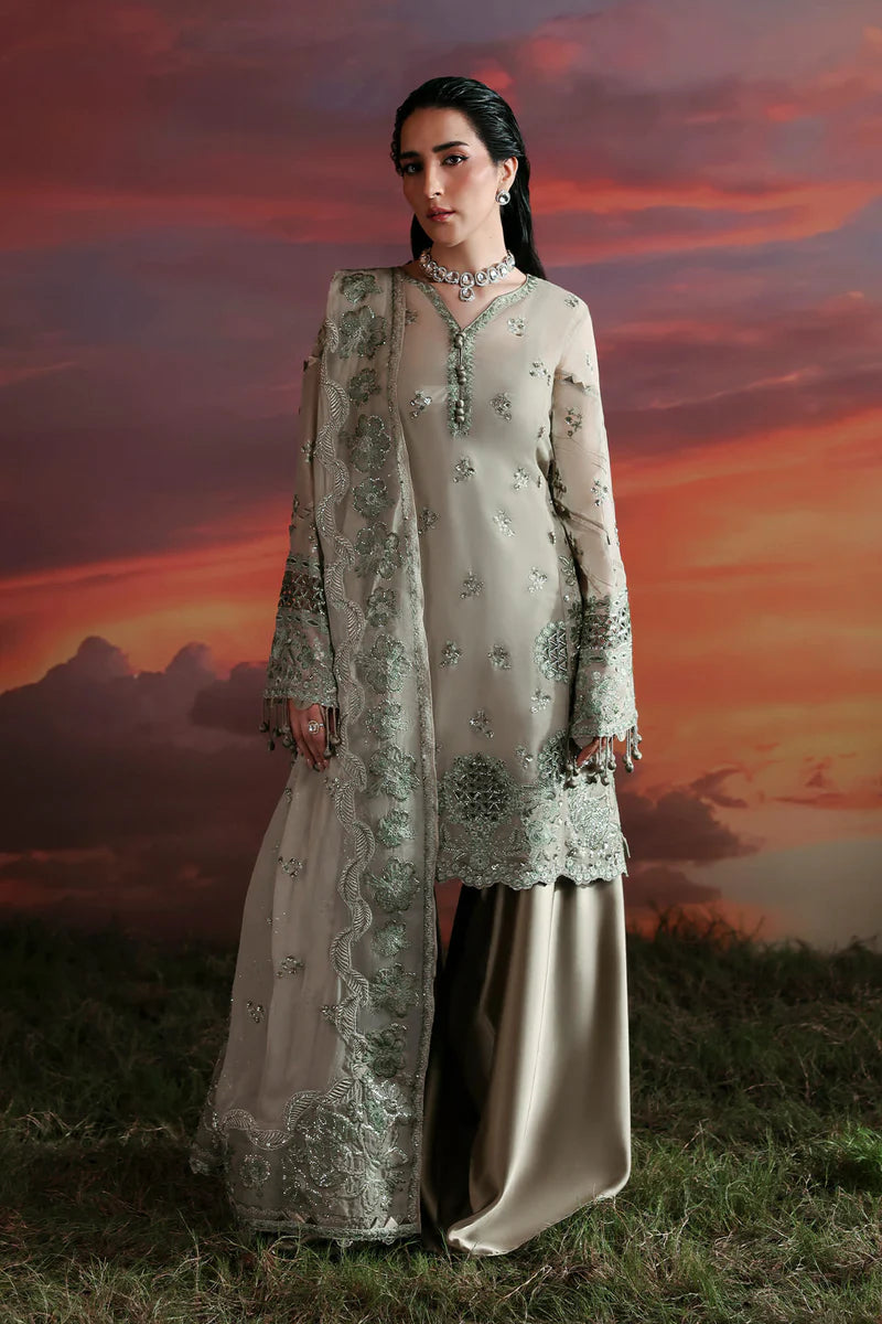 Woman in traditional outfit with sunset and clouds in the background