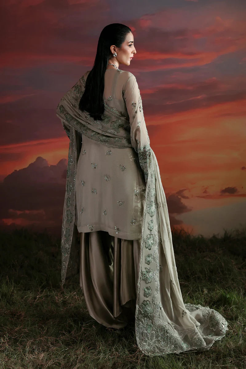 Woman in traditional outfit with a scenic sunset background
Nerine_By_Ruuposh_Collection_03
