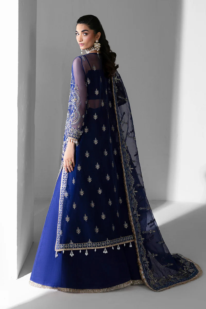 Woman wearing a blue embroidered traditional outfit with a gray backgroundOrchid_By_Ruuposh_Collection_6
