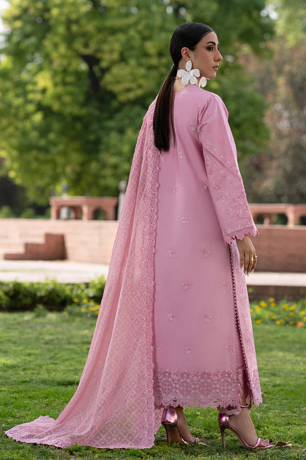 Woman in a pink traditional outfit standing outdoors with greenery in the background.
Roselle_By_Ruuposh_Collection_2