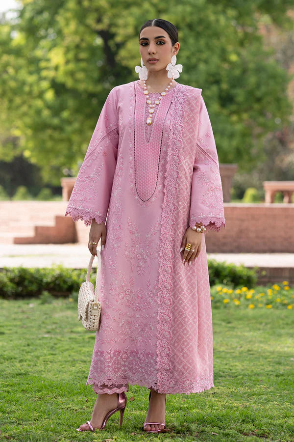 Woman in a pink lace dress standing outdoors with greenery in the background.
Roselle_By_Ruuposh_Collection_3