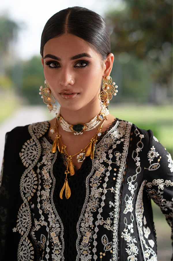 Woman wearing intricate jewelry and a black and white embroidered outfit outdoors.
Selara_By_Ruuposh_Collection_1
