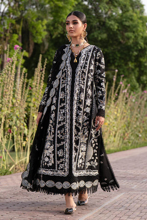 Woman wearing a black and white embroidered traditional outfit in an outdoor setting.
Selara_By_Ruuposh_Collection_2