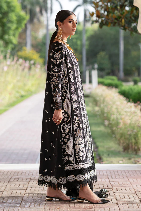 Woman in a black and white embroidered traditional outfit standing outdoors.
Selara_By_Ruuposh_Collection_5