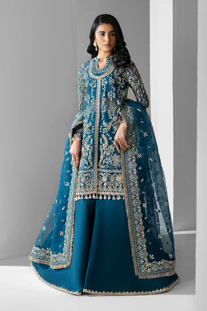 Woman wearing a blue embroidered traditional outfit against a gray background.
Twilight_By_Ruuposh_Collection_1