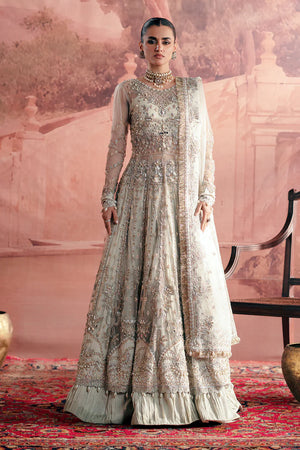 Woman in a traditional outfit with a scenic background.
chandni_By_Ruuposh_Collection_6