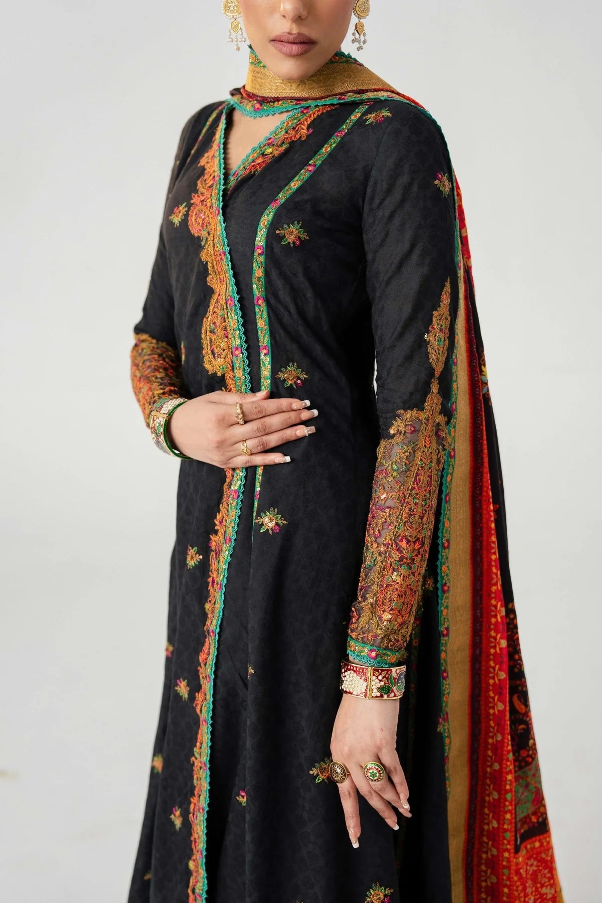 Black traditional outfit with colorful embroidery on a white background
dochalla_By_Ruuposh_Collection_04