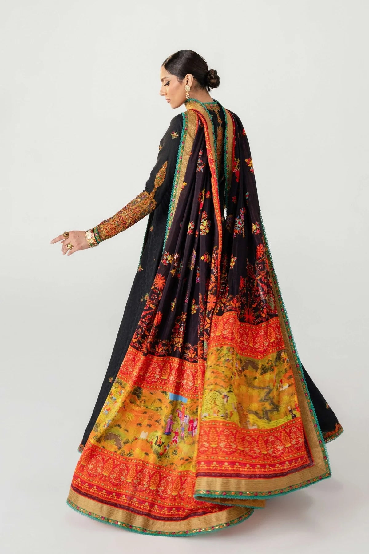 Woman wearing a traditional saree with a colorful design on a white background
dochalla_By_Ruuposh_Collection_05
