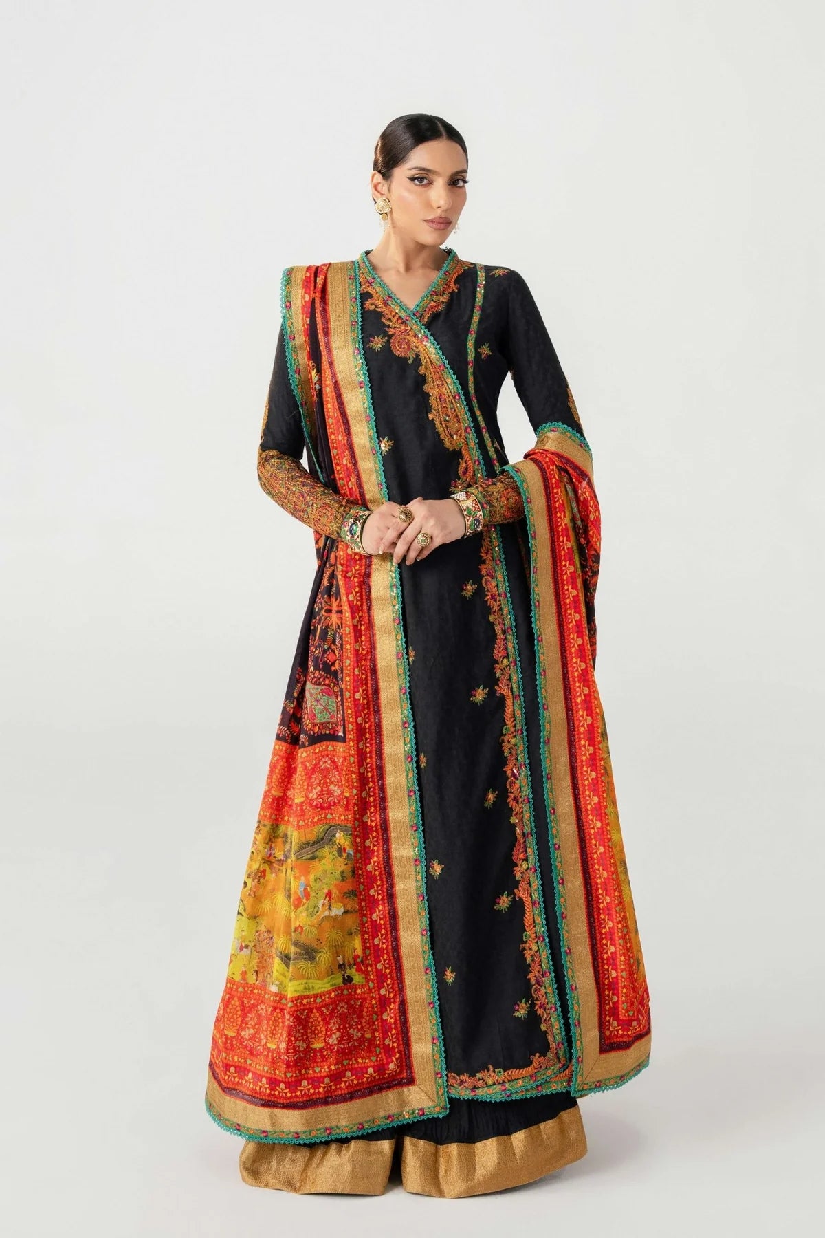 Woman wearing a traditional outfit with a colorful dupatta on a white background
dochalla_By_Ruuposh_Collection_07